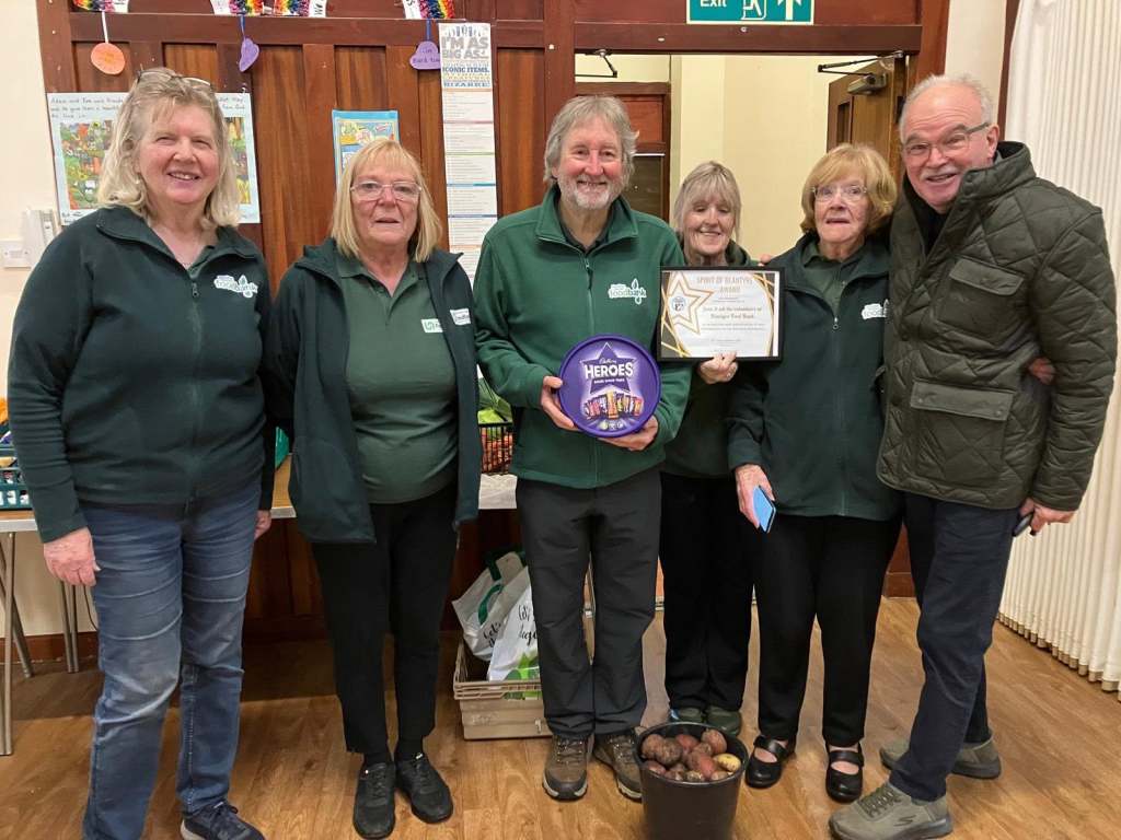 Foodbank representatives with a Spirit of Blantyre certificate